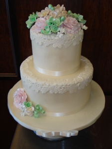 Delicate Engagement Cake with Hand-made Sugar flowers.